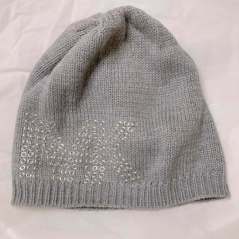 Michael Kor hat. Grey with silvery rings designs for MK logo